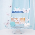 Pastelowy motyl topper na tort